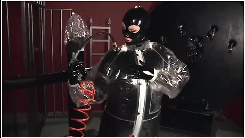 Blonde Girl In Black Latex Catsuit Full Encased In Inflatable Rubber And Full Body Plastic Suit