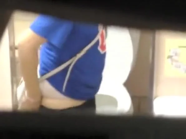 Brunette woman spied in public toilet pissing