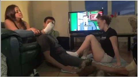 Cute Male Slave Receives Hot Footjob While Sniffing Feet In Fetish Threesome