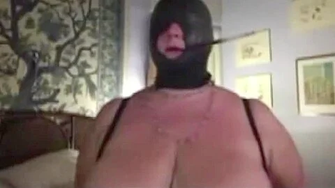 Augusta- A slut wife bound, hooded and smoking with cigarett