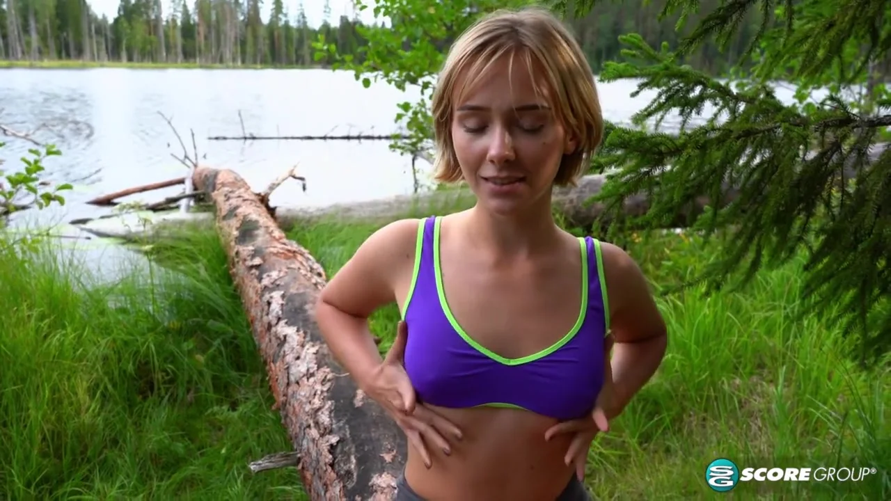 Outdoorsy blonde with cute, perky tits drops her yoga pants and spreads her pussy next to a lake.