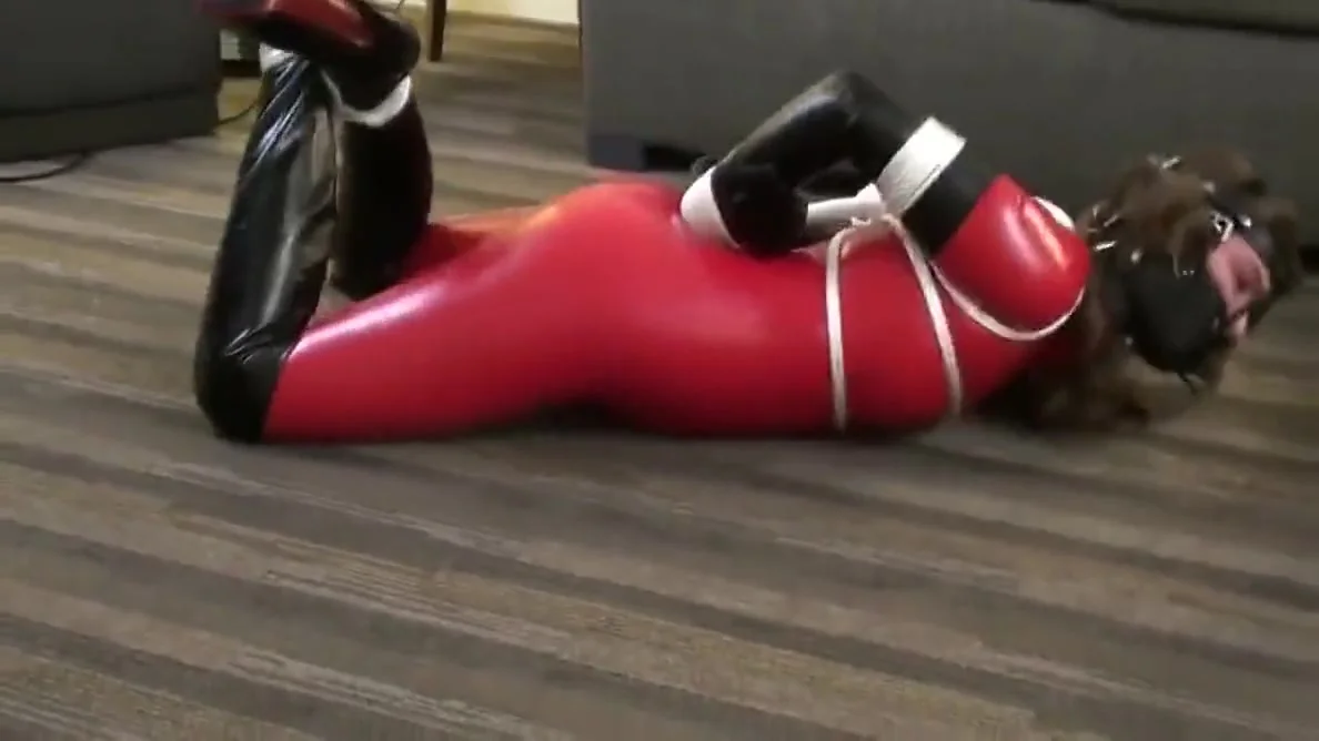 Red Latex Catsuit Girl Muzzled And Tied Up