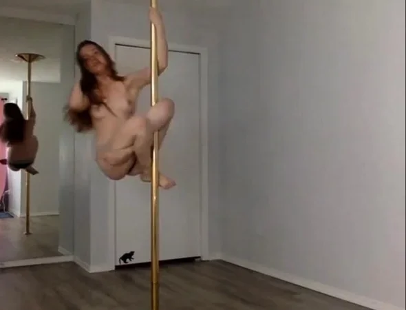 Cute Redhead Performing Topless Pole Dance