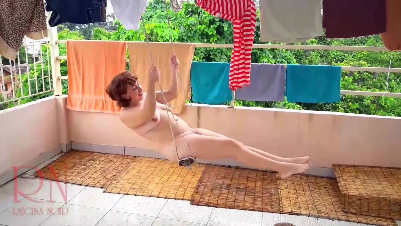 Naked Laundry. The Maid Is Drying Clothes In The Laundry