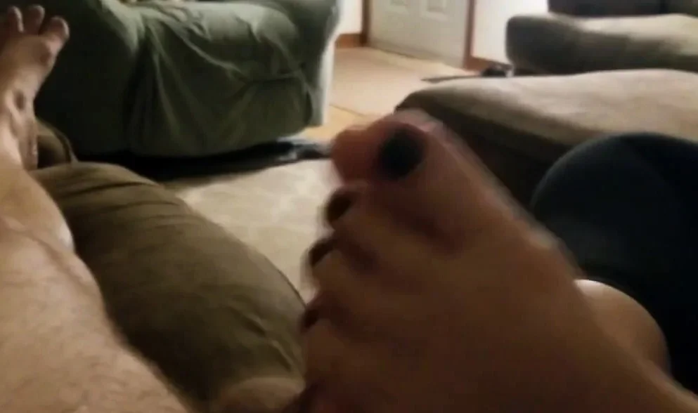 Husband's cock rubbed by his mature wife's silky feet