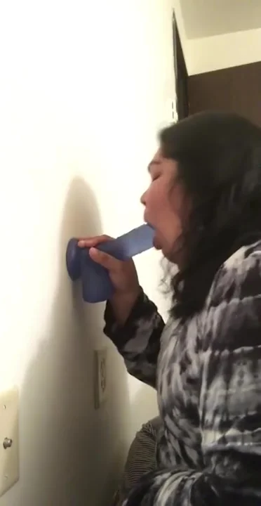 Latina sucks on dildo