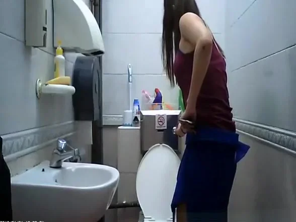 teen 18+ seats in toilet to take a pee