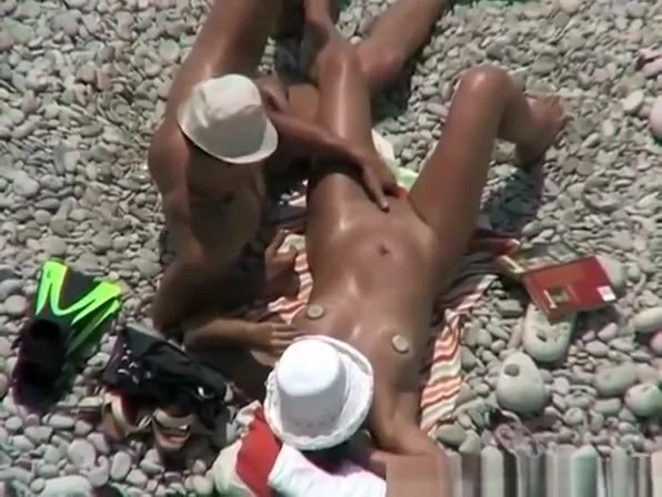 Nudist woman fingered at beach