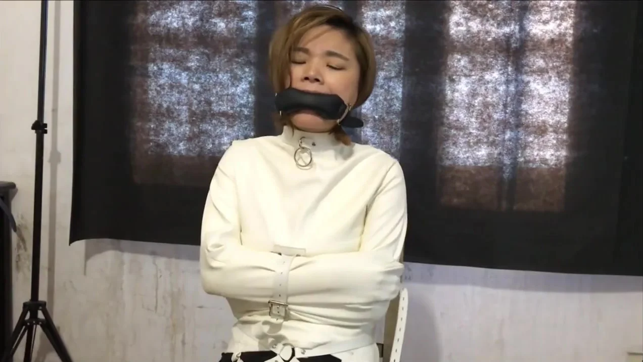 Cute Asian In Straightjacket And Collared