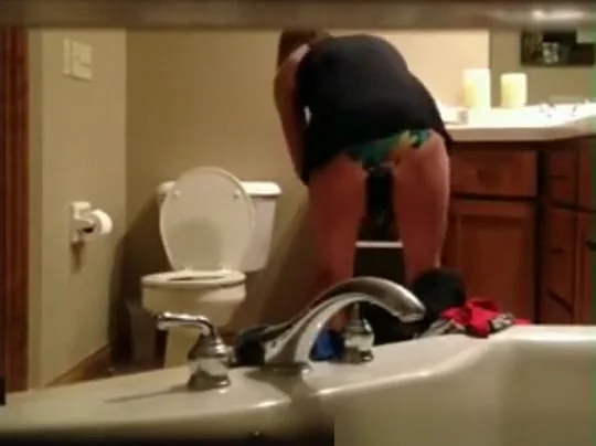 Milf caught in bathroom hidd cam