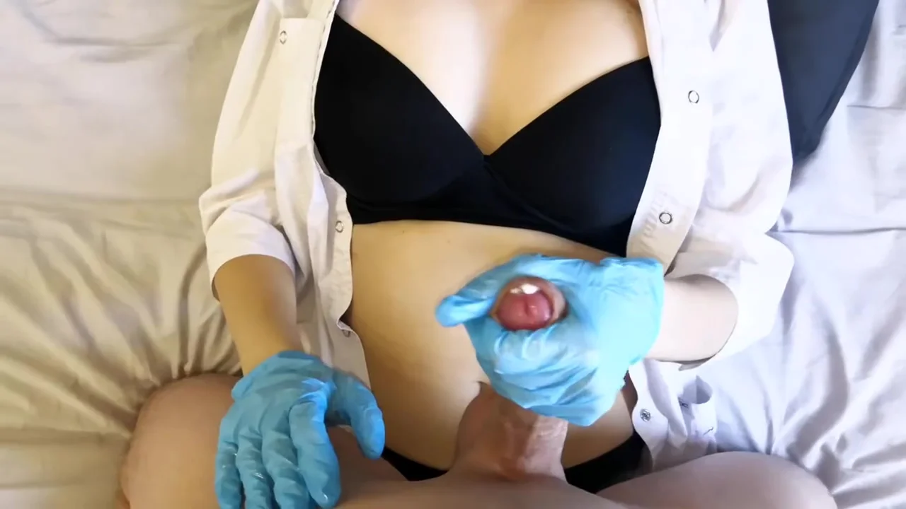 Doctor in gloves checks the perfomance of the dick