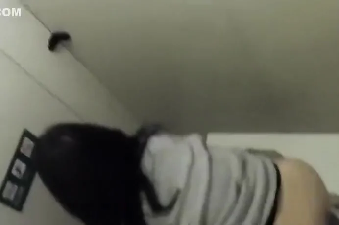 Hairy asian pussy spied while she pees