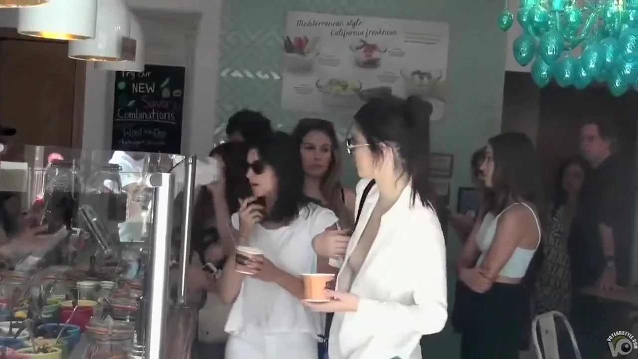 Smoking hot celebrity walks around in a flimsy shirt and tight pants