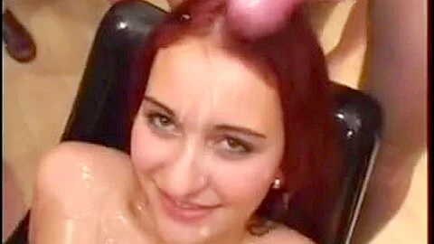 Gang bang bukkake featuring a sexy redheaded babe