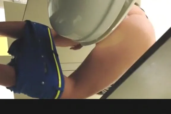 Girl in blue shorts pissing