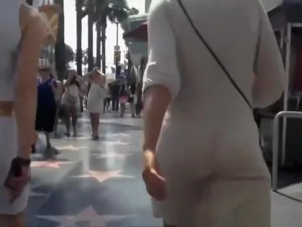 Woman in see through dress black thong