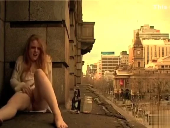 Ginger girl masturbates in public outside her apartment