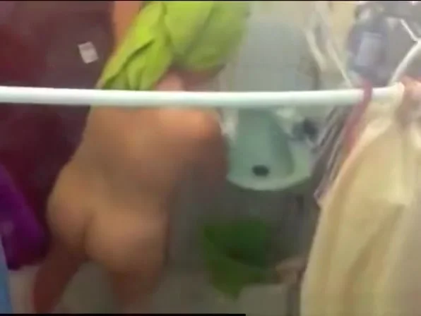 Woman spied in bathroom through the window