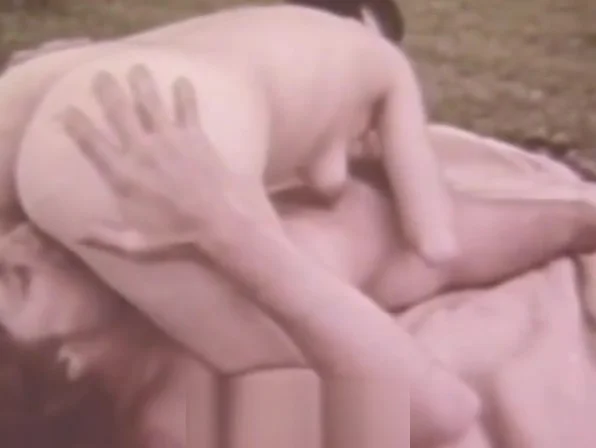 Young Couple Relaxing in the Nature (1960s Vintage)