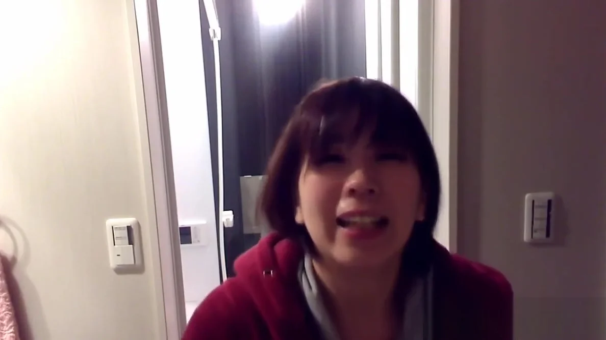 Peeing asian fills glass