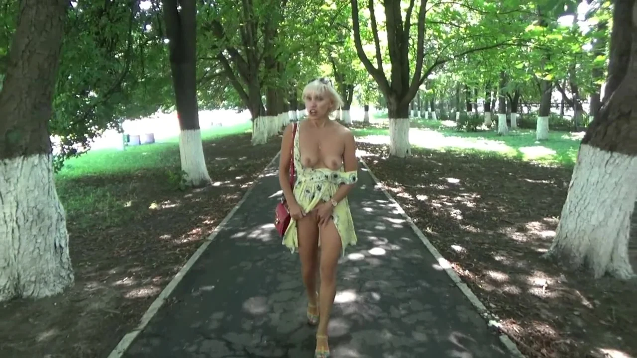 Sexy blonde flashing and hot masturbating in a public park.