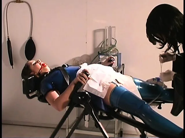 Mistress Jean is the fetish queen and ties up her latex clad slaves