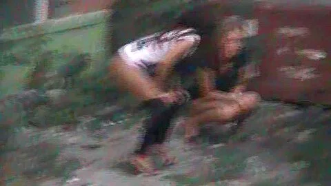 Hidden peeing cam shooting two girls pissing in the yard