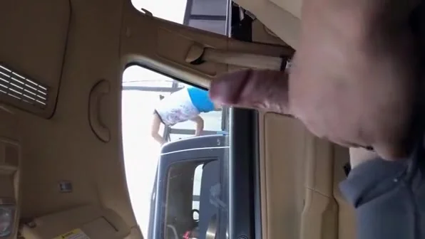 Guy strokes dick in car