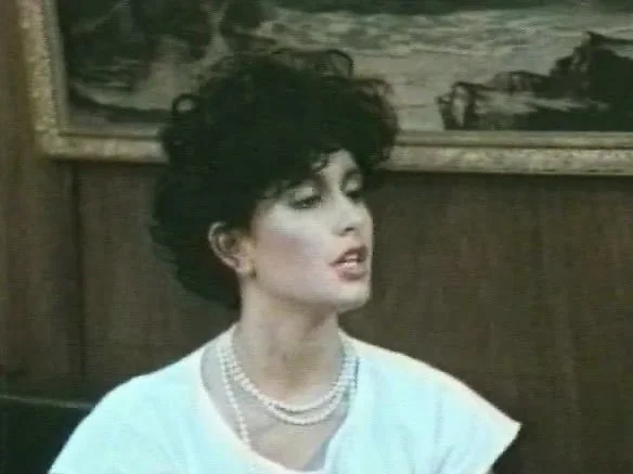 Vintage film showcasing a brunette broad doing what she does best