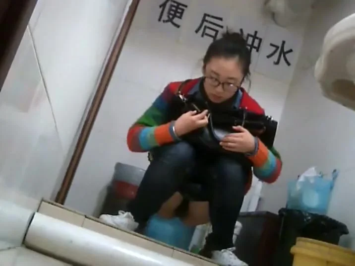 Nerdy chinese girl caught taking a leak
