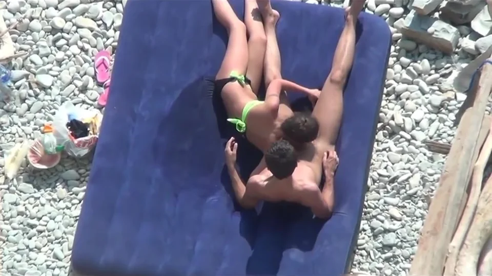 Gf blowing bf on a beach and playing with his ass