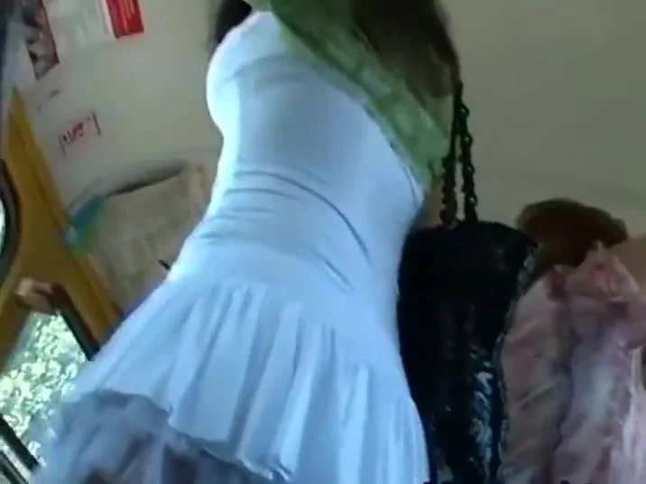Peeping under a fluffy skirt at a bus