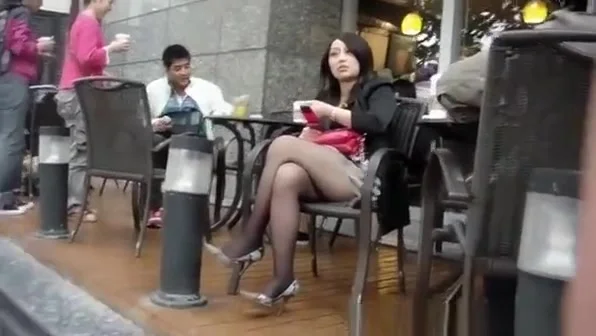 Sexy legs brunette in short skirt