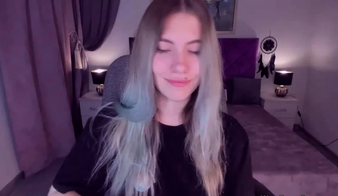 Blonde teen smoking and stripping off