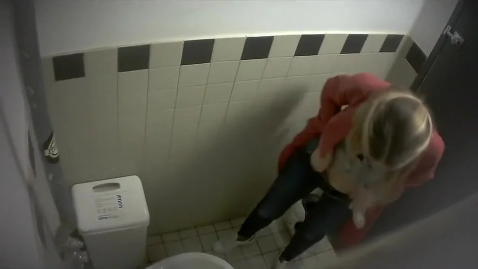 Blonde filmed from above when taking a pee