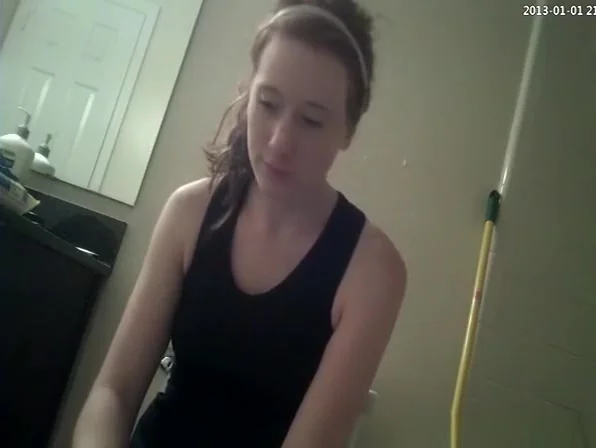 Girl caught in bathroom using the toilet
