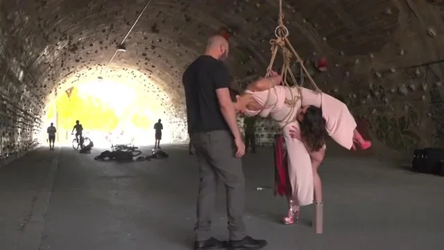 Brunette beauty suspended and whipped outdoor
