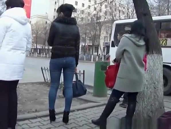 Chick in high heels and tight jeans pants