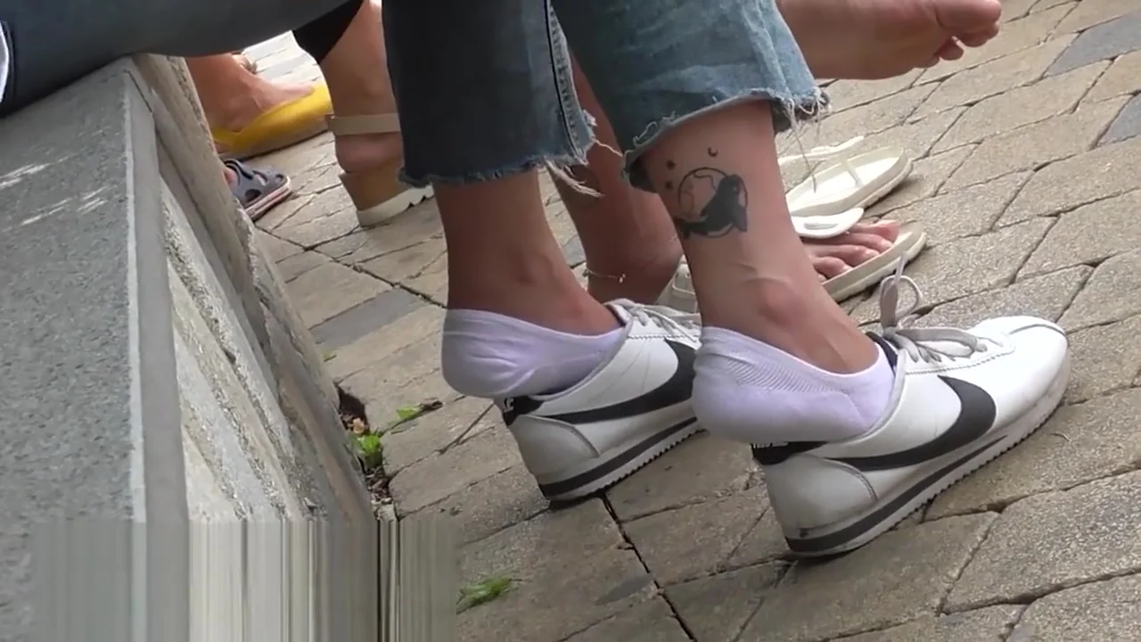 white sneaker socks and some bare feet in the background