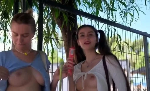 Alissa and Lana Braless and Pantiless on the beach promenade