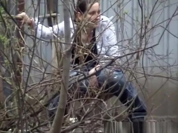 Two girls caught peeing outside
