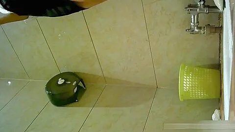 Chinese girl pissing in toilet