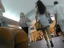 Awesome upskirt pussy of brunette covered with panties