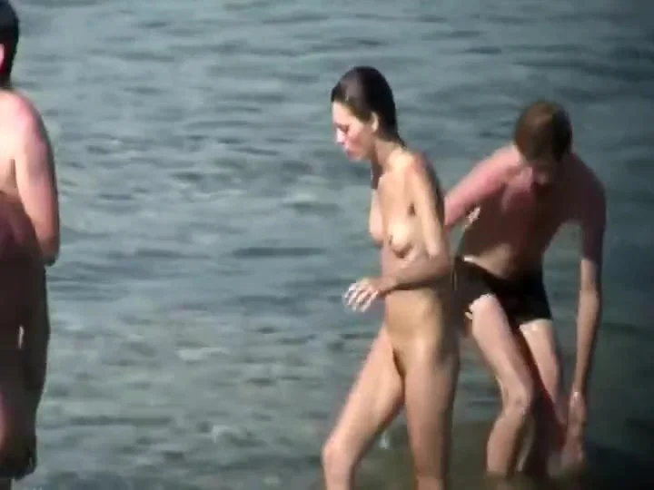 Skinny nude girl creeped on at a beach