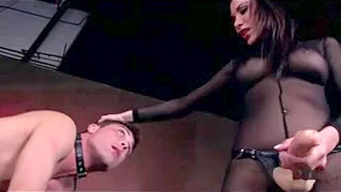 Caged slave gets a strapon up his ass