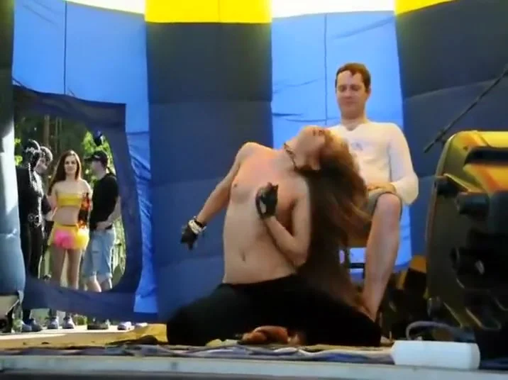 Foxy girl does a lap dance in a studio