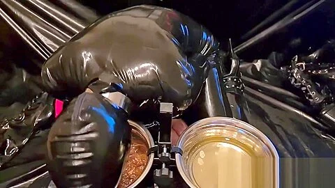 Slave Slut-Orgasma Celeste in black latex eating dog food and drinking piss
