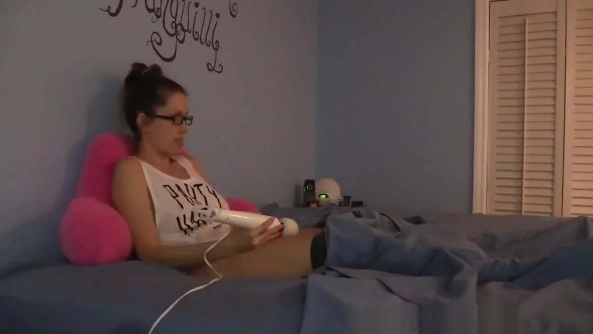Shy nerdy girl masturbates under the sheets in pajamas