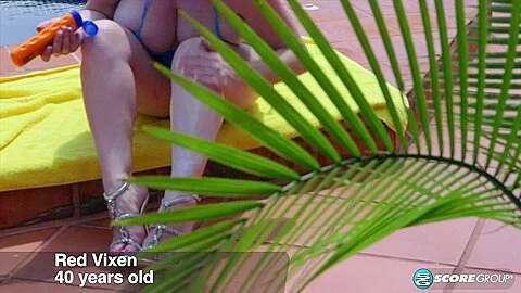 Red Vixen, busty bikini MILF - 40SomethingMag