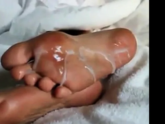 Huge load of cum over Mary's sexy feet soles!